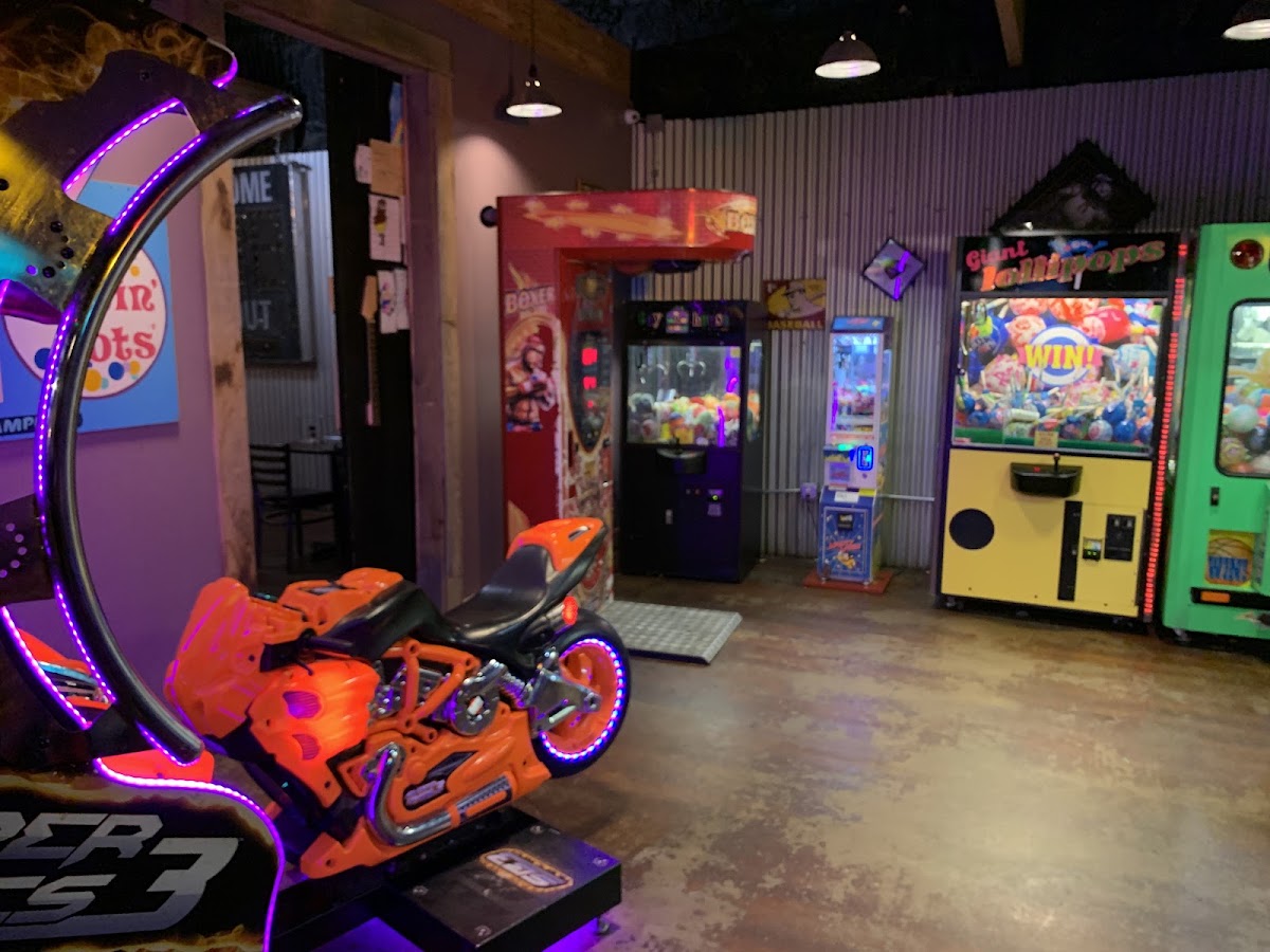 Arcade games inside a Lost Pizza Co. game room